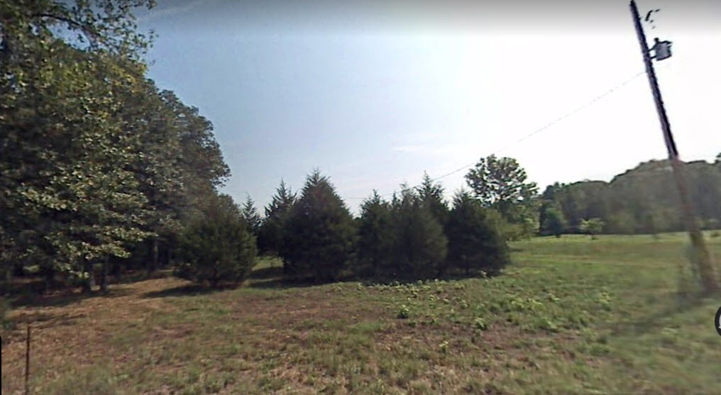 Corner of property has utility pole w transformer